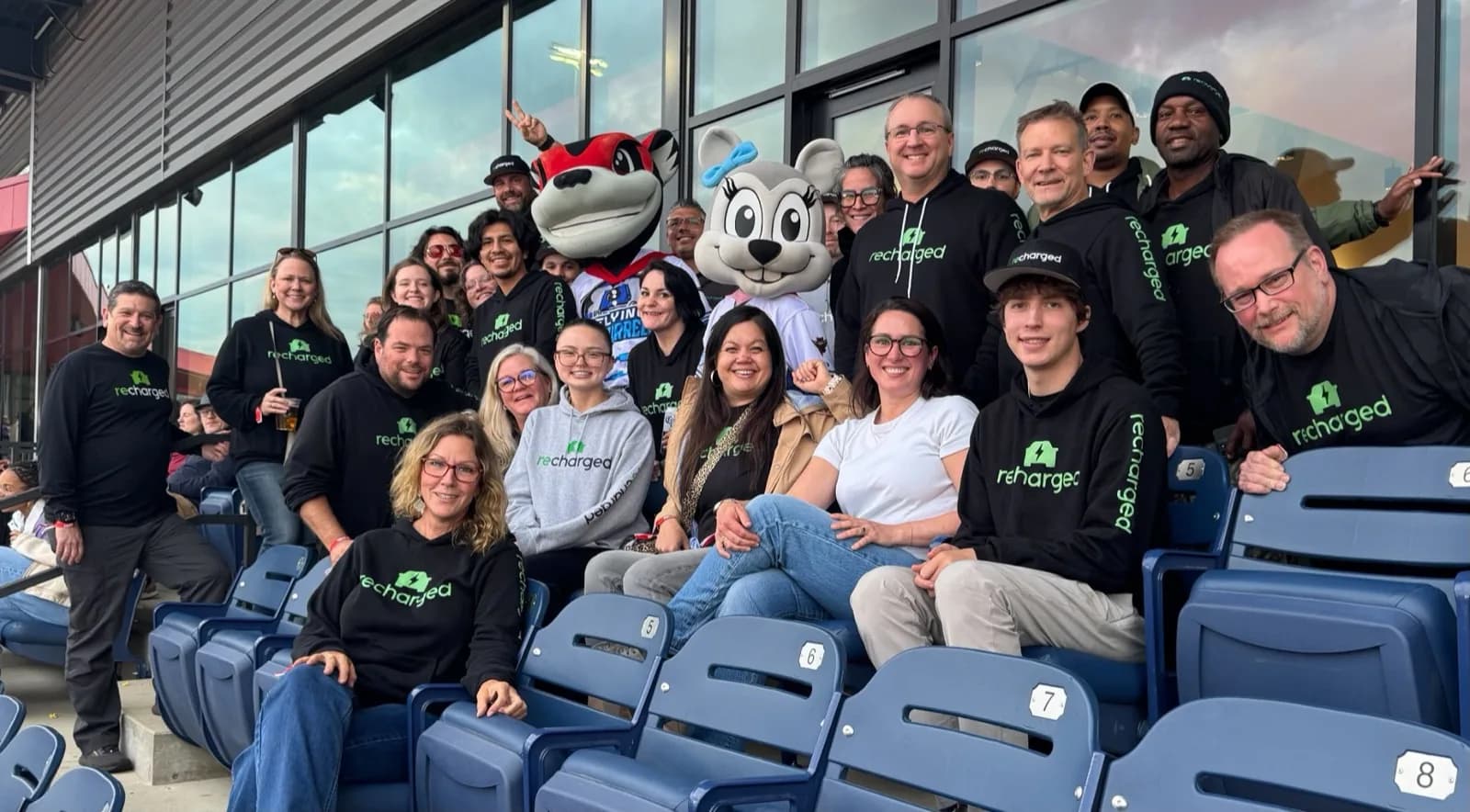 Recharged team members at a baseball game